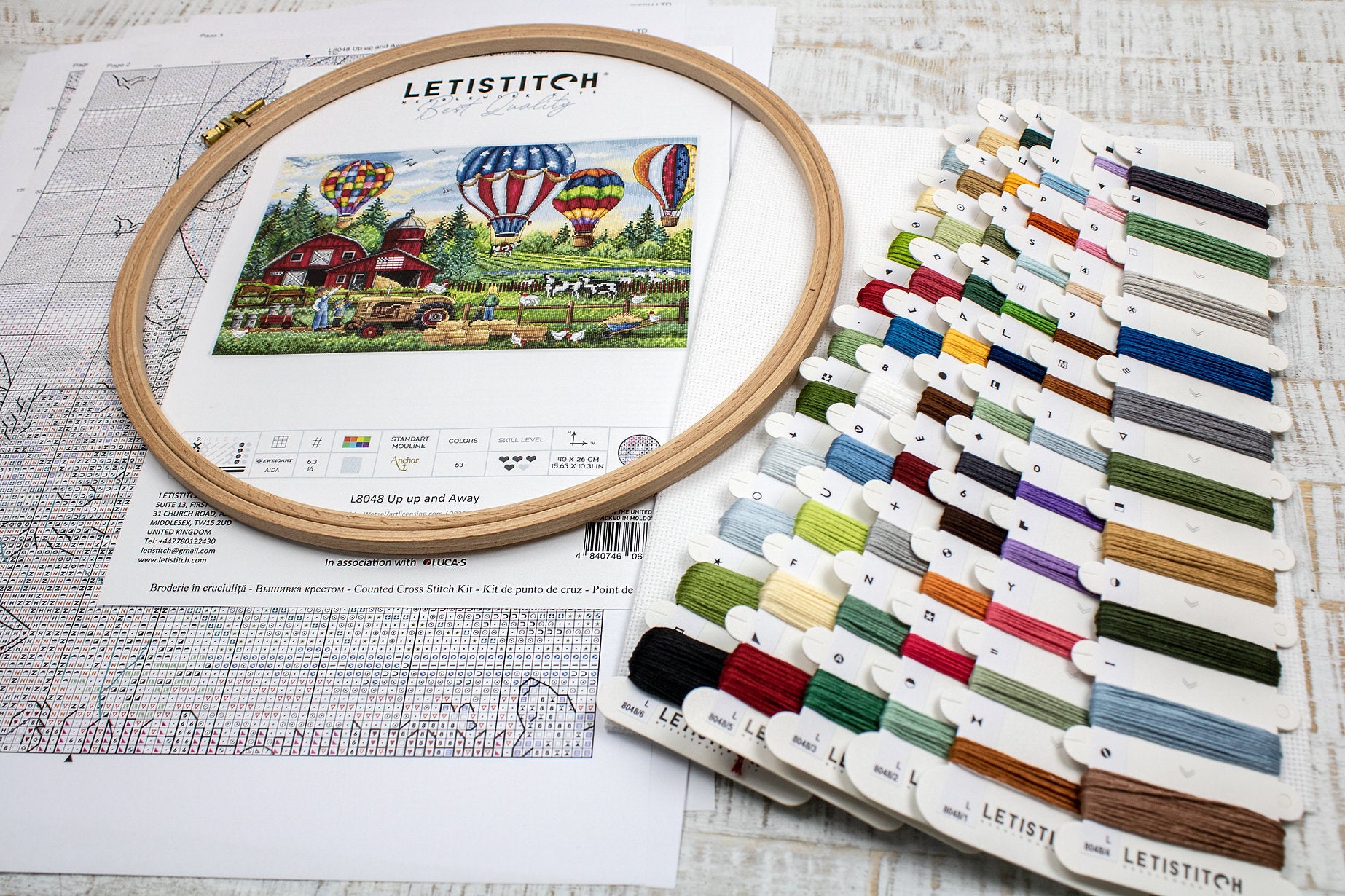 Up Up and Away L8048 Counted Cross Stitch Kit featuring colorful threads, Aida canvas, and detailed instruction chart.